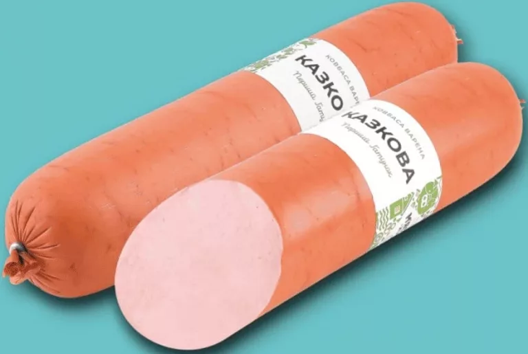 Ковбаса «Казкова» варена, ТМ М’ясний хутір; за 100 г; Сімі/Сім23 01–14.10.2026; може бути не в усіх магазинах; ціни можуть змінюватись